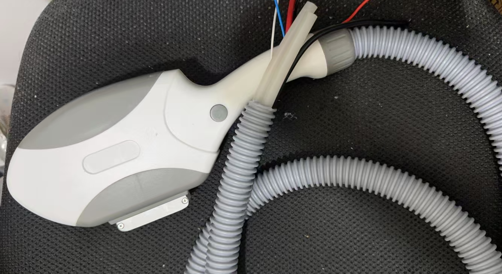 Reassembled IPL handpiece after lamp replacement